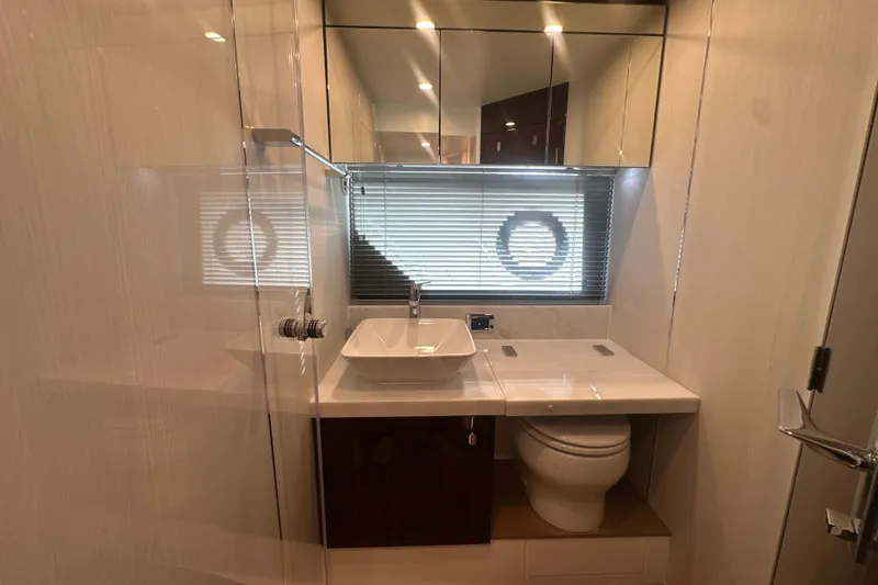Slide: The Image of Luxurious bathroom interior of 2024 Fairline Squadron 50 yacht, featuring modern fixtures and elegant design. - 50
