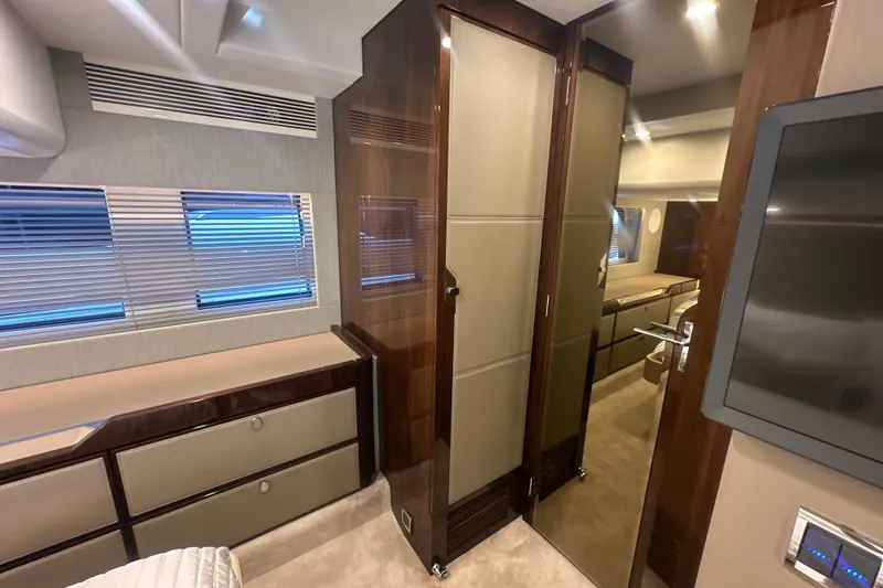 Slide: The Image of Luxurious interior of 2024 Fairline Squadron 50 yacht with modern cabinetry and lighting. - 52