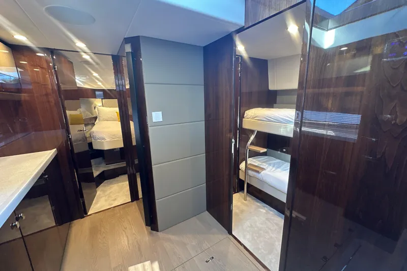 Slide: The Image of Luxurious interior of 2024 Fairline Squadron 50 yacht with modern wood finishes and bunk beds. - 53
