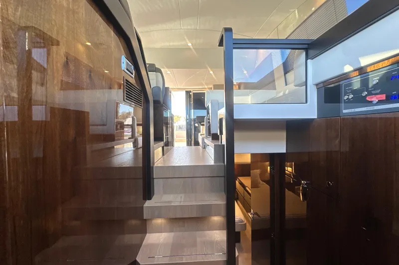Slide: The Image of Interior view of 2024 Fairline Squadron 50 yacht, showcasing luxurious wooden finishes and modern design. - 54