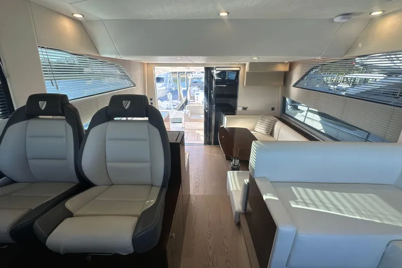 Slide: The Image of Luxurious interior of 2024 Fairline Squadron 50 yacht with modern seating and elegant design. - 55