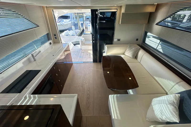 Slide: The Image of Luxurious interior of 2024 Fairline Squadron 50 yacht with modern kitchen and seating area. - 56
