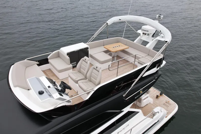 Slide: The Image of 2024 Fairline Squadron 50 yacht with spacious deck and seating on open water. - 59
