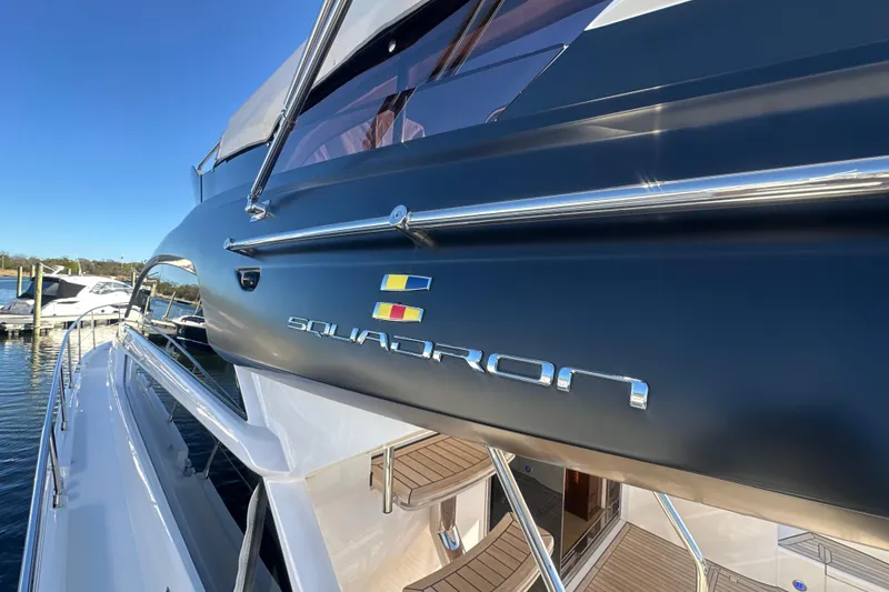 Slide: The Image of 2024 Fairline Squadron 50 yacht, sleek design, docked at marina. - 67