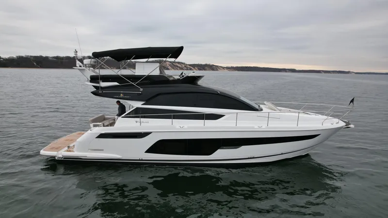 Slide: The Image of 2024 Fairline Squadron 50 luxury yacht on open water. - 72