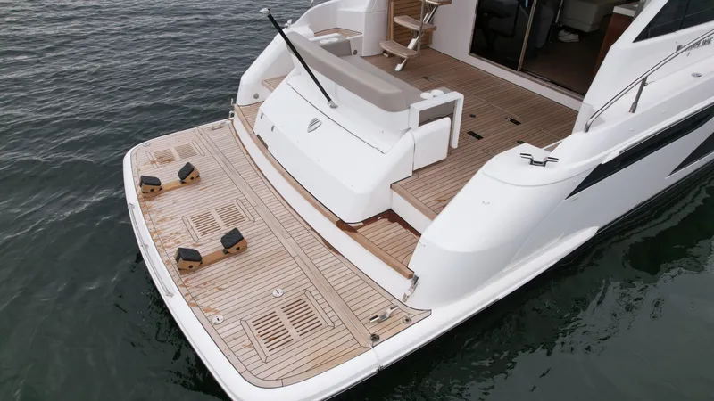 Slide: The Image of 2024 Fairline Squadron 50 yacht with spacious teak deck and swim platform. - 8