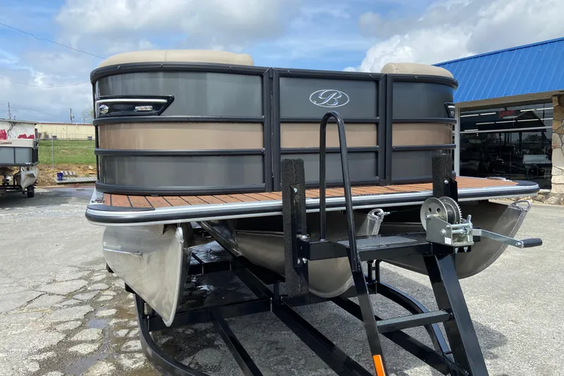 Slide: The Image of 2026 Bentley Pontoons 25 Elite Swingback on trailer, gray design. - 3