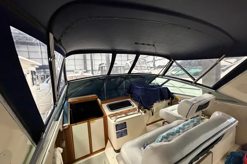 Slide: The Image of Interior view of 1986 Sea Ray 340 Sundancer boat with seating and helm. - 10