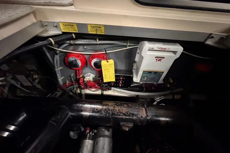 Slide: The Image of Electrical system of a 1986 Sea Ray 340 Sundancer boat, featuring wiring and battery components. - 25