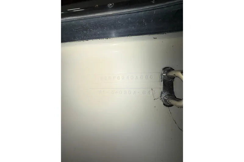 Slide: The Image of 1986 Sea Ray 340 Sundancer hull identification number on boat exterior. - 29