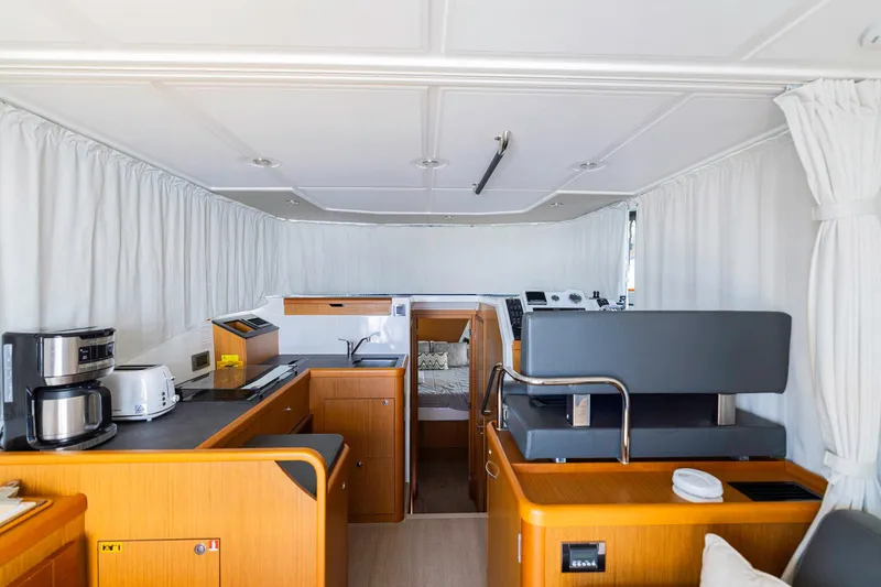Slide: The Image of Interior of 2019 Beneteau Swift Trawler 35 with modern kitchen and helm station. - 20