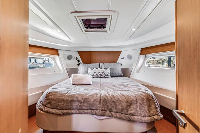 Slide: The Image of Luxurious cabin interior of 2019 Beneteau Swift Trawler 35 with cozy bedding. - 22