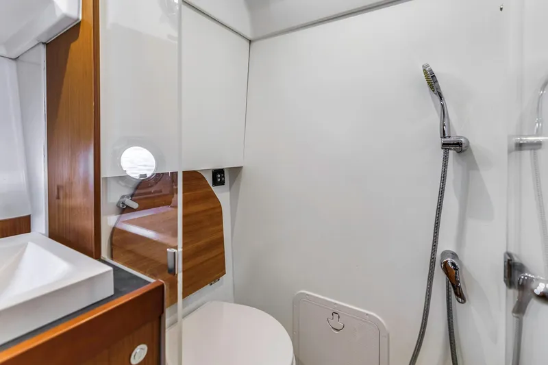 Slide: The Image of Bathroom interior of 2019 Beneteau Swift Trawler 35, featuring shower and modern fixtures. - 27