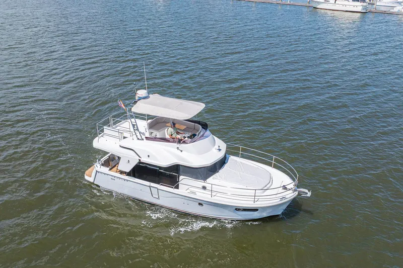 Slide: The Image of 2019 Beneteau Swift Trawler 35 cruising on open water. - 3