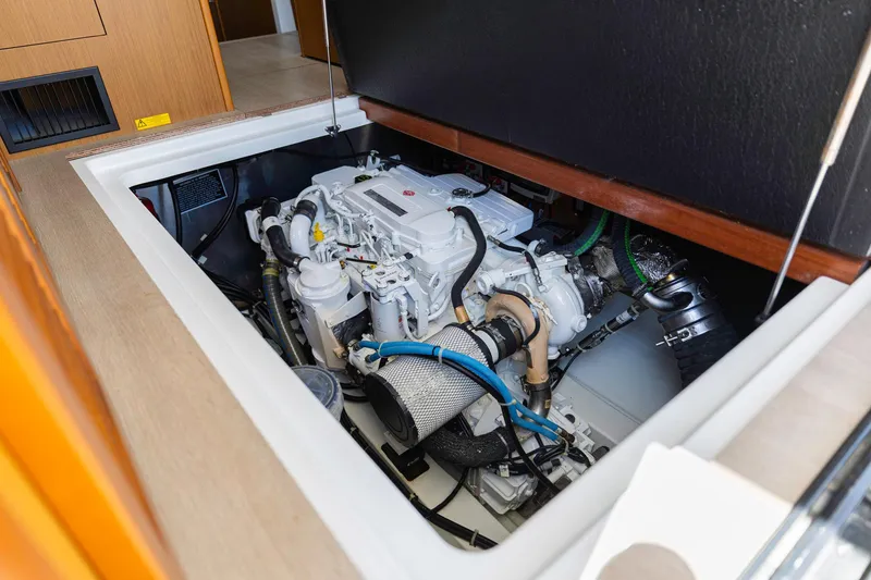 Slide: The Image of Engine compartment of a 2019 Beneteau Swift Trawler 35, showcasing mechanical components. - 45