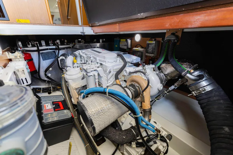 Slide: The Image of Engine room of 2019 Beneteau Swift Trawler 35, showcasing mechanical components and wiring. - 47