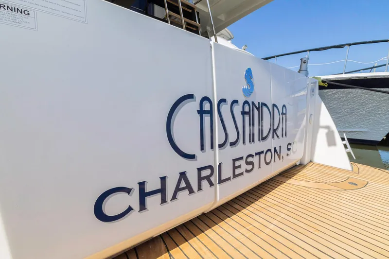 Slide: The Image of 2019 Beneteau Swift Trawler 35 docked, featuring "Cassandra Charleston, SC" on the stern. - 48