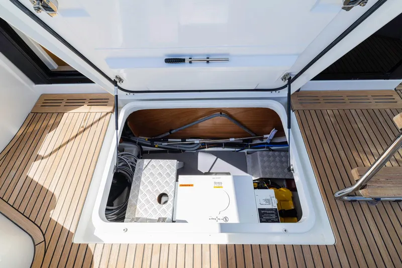 Slide: The Image of Storage compartment of 2019 Beneteau Swift Trawler 35 with equipment and cables. - 49