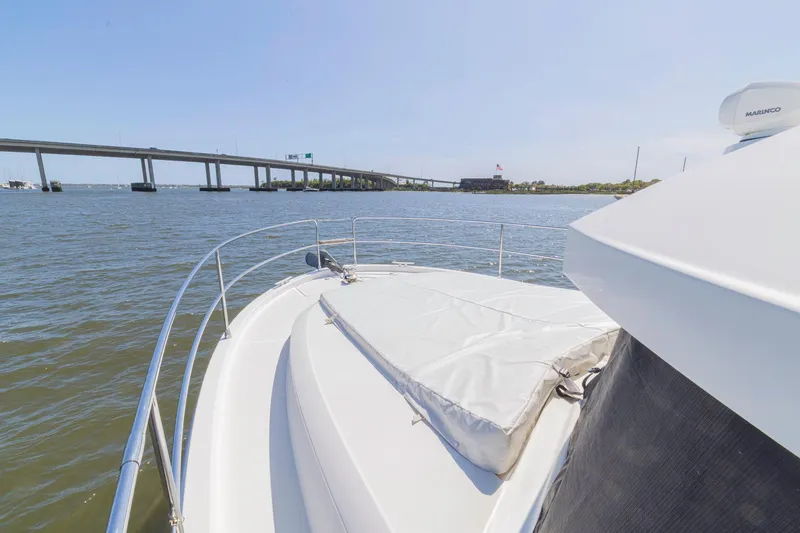 Slide: The Image of 2019 Beneteau Swift Trawler 35 cruising under a bridge on a sunny day. - 59