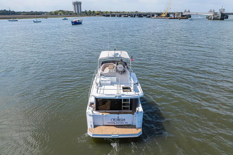 Slide: The Image of 2019 Beneteau Swift Trawler 35 cruising in Charleston waters, rear view. - 6
