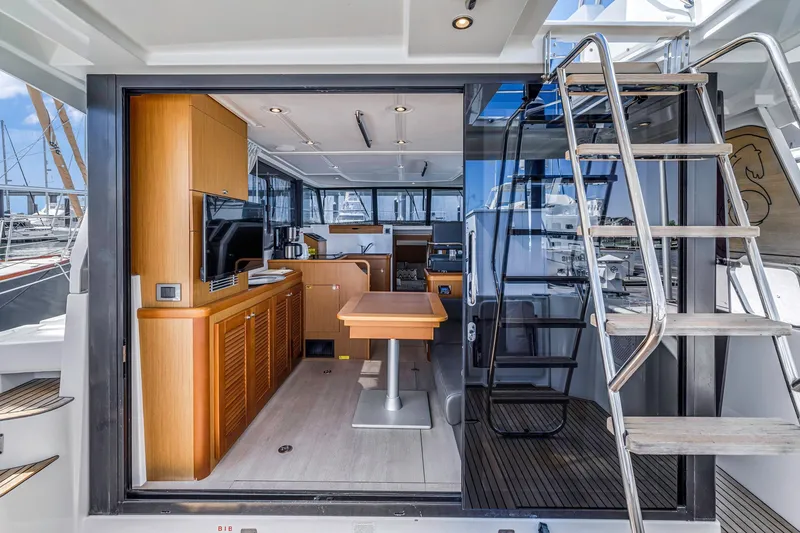 Slide: The Image of 2019 Beneteau Swift Trawler 35 interior with modern kitchen and dining area. - 8