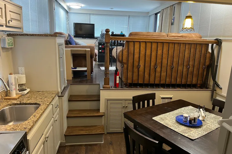 Slide: The Image of Interior of 1995 WaveLenth Wide Body RV with kitchen and living area. - 10