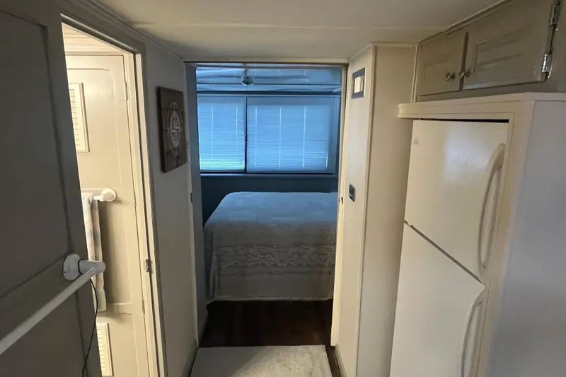 Slide: The Image of Narrow hallway in 1995 WaveLenth Wide Body RV, leading to bedroom with bed. - 12