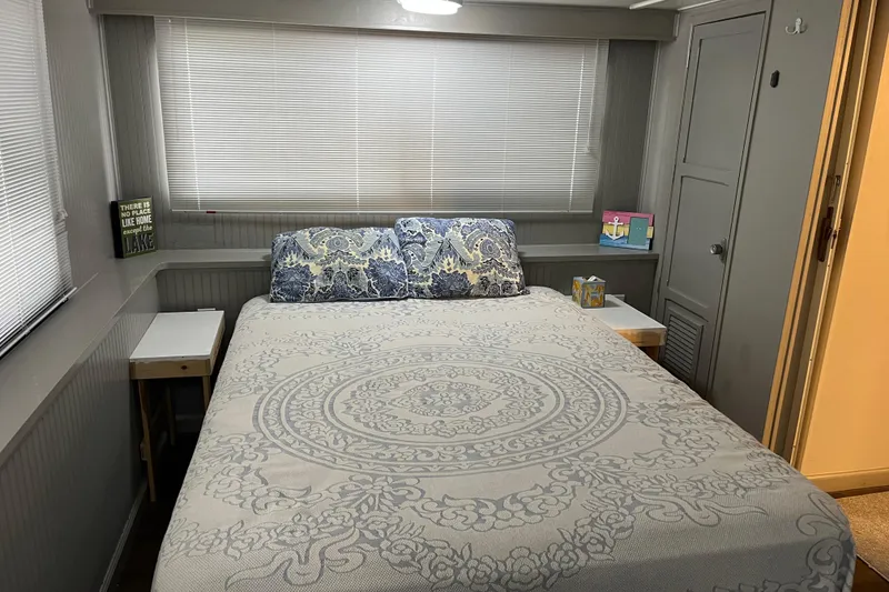 Slide: The Image of Cozy bedroom in 1995 WaveLenth Wide Body, featuring patterned bedding and decorative pillows. - 20