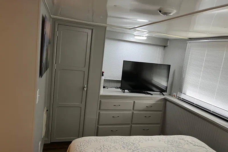 Slide: The Image of Bedroom interior of 1995 WaveLenth Wide Body with TV and storage drawers. - 22