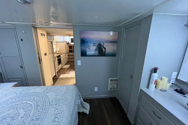 Slide: The Image of Interior of a 1995 WaveLenth Wide Body RV with kitchen and bedroom. - 24