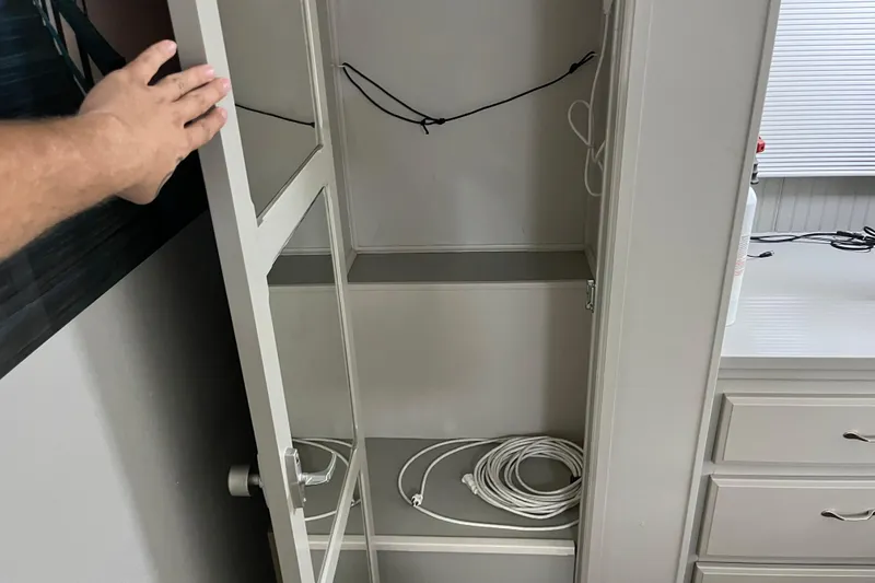 Slide: The Image of Open cabinet with cables inside, WaveLenth Wide Body 1995 model. - 25