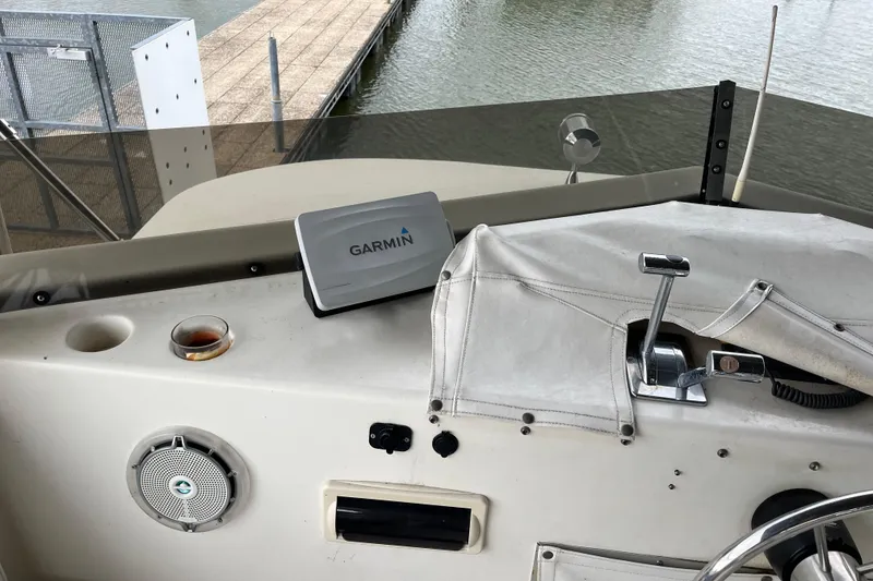 Slide: The Image of Cockpit of 1995 WaveLenth Wide Body boat with Garmin GPS and throttle controls. - 37