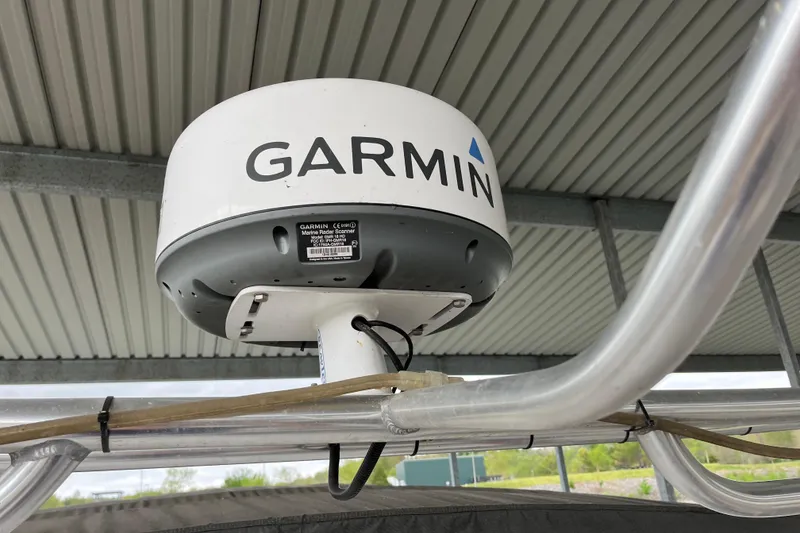 Slide: The Image of Garmin marine radar scanner on 1995 WaveLenth Wide Body boat under metal roof. - 41