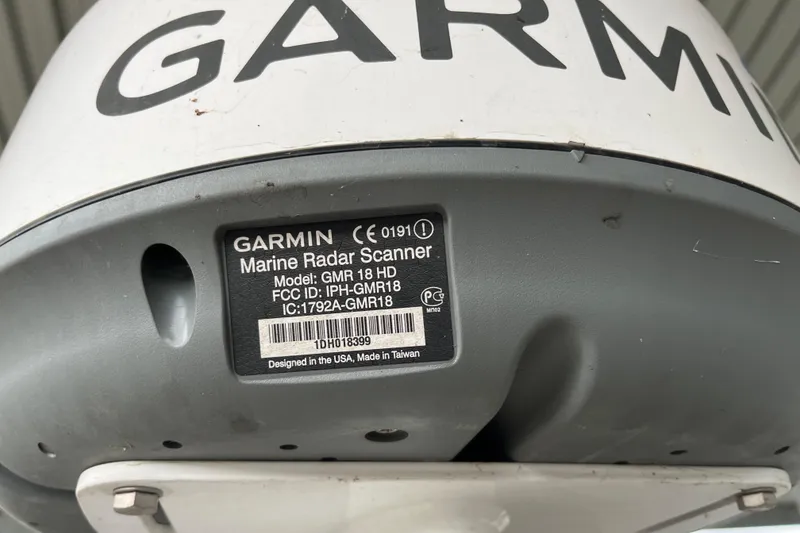 Slide: The Image of Garmin marine radar scanner, model GMR 18 HD, close-up view with label details. - 42