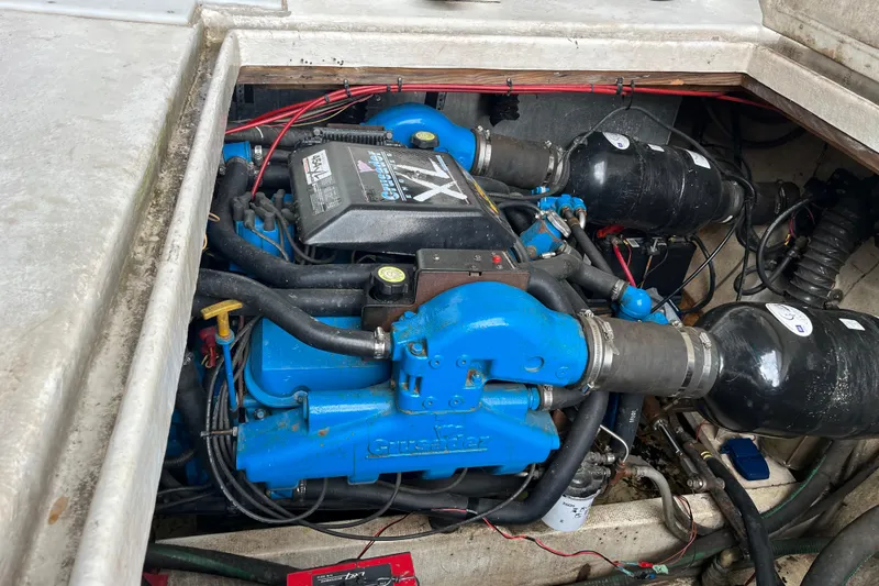 Slide: The Image of Engine compartment of a 1995 WaveLenth Wide Body boat, featuring a Crusader engine. - 51