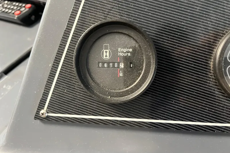 Slide: The Image of Close-up of a 1995 WaveLenth Wide Body engine hour meter displaying 610.2 hours. - 53