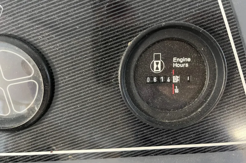 Slide: The Image of Close-up of a 1995 WaveLenth Wide Body engine hour meter displaying 614.1 hours. - 54