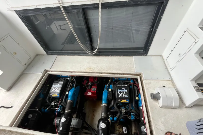 Slide: The Image of Engine compartment of a 1995 WaveLenth Wide Body boat with Crusader XL engines. - 56