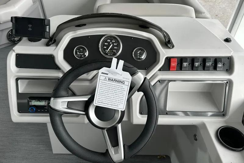 Slide: The Image of Steering console of 2026 Sweetwater EX2086S boat with gauges and controls. - 10