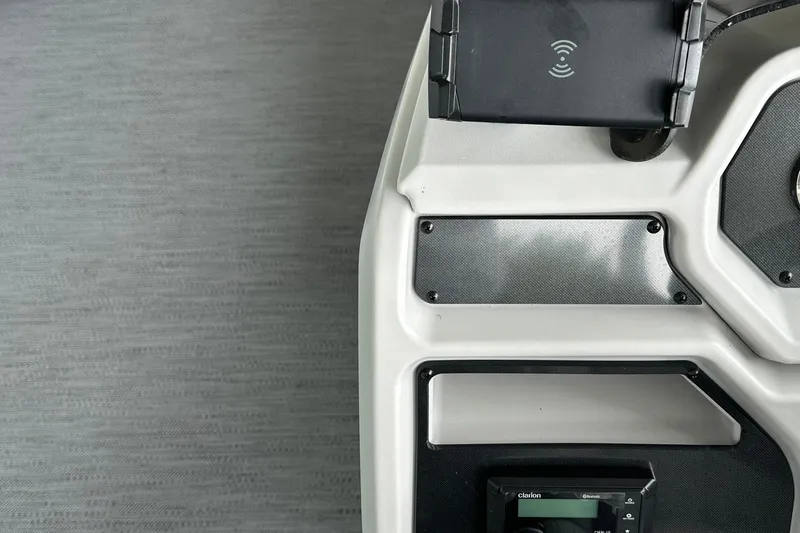 Slide: The Image of Control panel of 2026 Sweetwater EX2086S boat with wireless charging pad. - 11