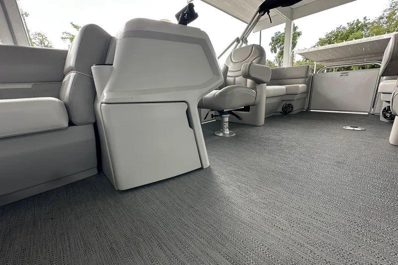 Slide: The Image of Interior of 2026 Sweetwater EX2086S pontoon boat with gray seating and flooring. - 13
