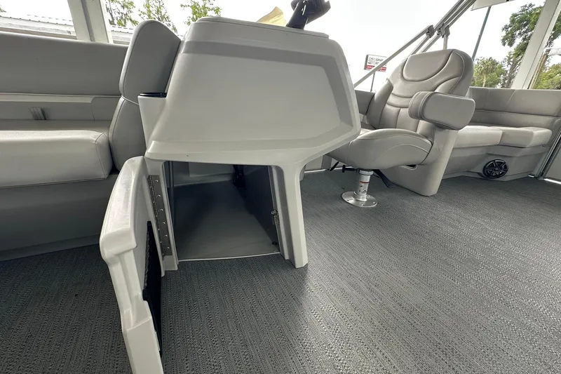 Slide: The Image of Interior of 2026 Sweetwater EX2086S boat with gray seating and carpeted flooring. - 14