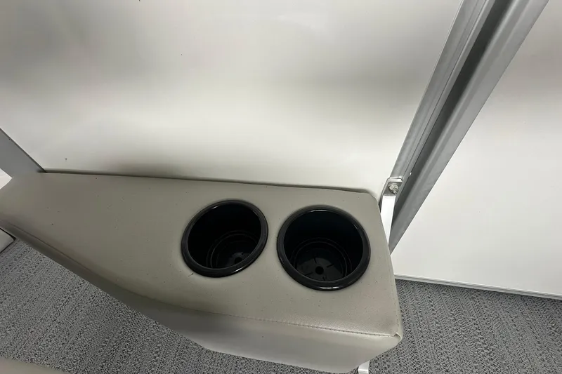 Slide: The Image of Cup holders in a 2026 Sweetwater EX2086S boat interior. - 19