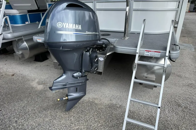 Slide: The Image of Sweetwater EX2086S 2026 pontoon boat with Yamaha outboard motor and boarding ladder. - 27