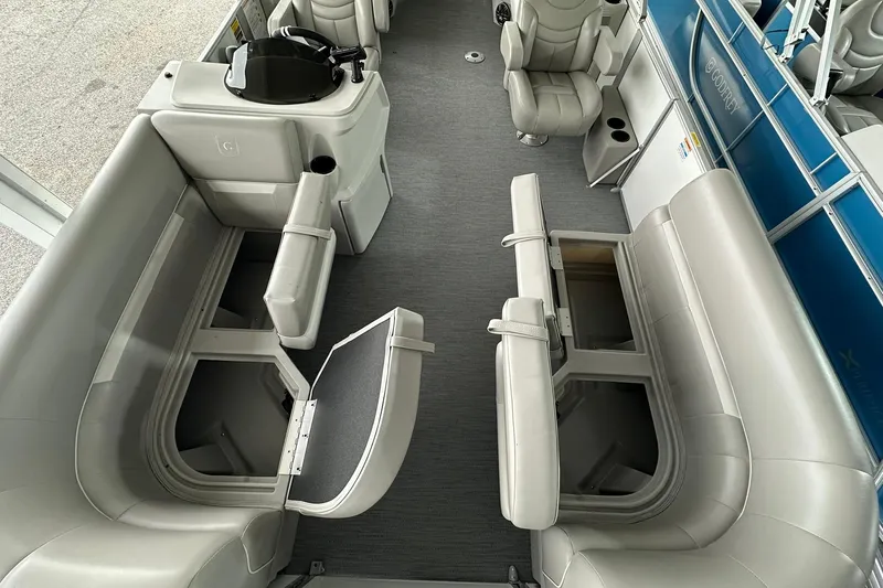 Slide: The Image of Interior of 2026 Sweetwater EX2086S pontoon boat with open storage compartments. - 6