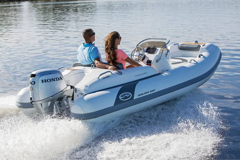 Slide: The Image of Manufacturer Provided Image: Walker Bay Generation 400 DLX 2025 boat cruising on water with Honda engine. - 4