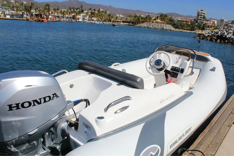 Slide: The Image of Manufacturer Provided Image: 2025 Walker Bay Generation 360 DLX boat with Honda engine docked by the water. - 6