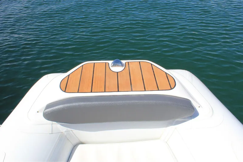 Slide: The Image of Manufacturer Provided Image: Walker Bay Generation 360 DLX 2025 boat with teak deck, floating on calm water. - 8