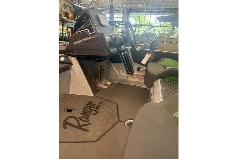 Slide: The Image of 2026 Ranger Z519R boat interior with steering wheel and seating, showcasing modern design. - 3