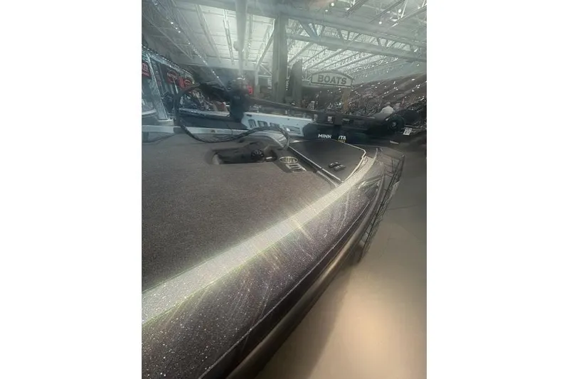 Slide: The Image of 2026 Ranger Z519R boat displayed indoors, showcasing sleek design and advanced features. - 2